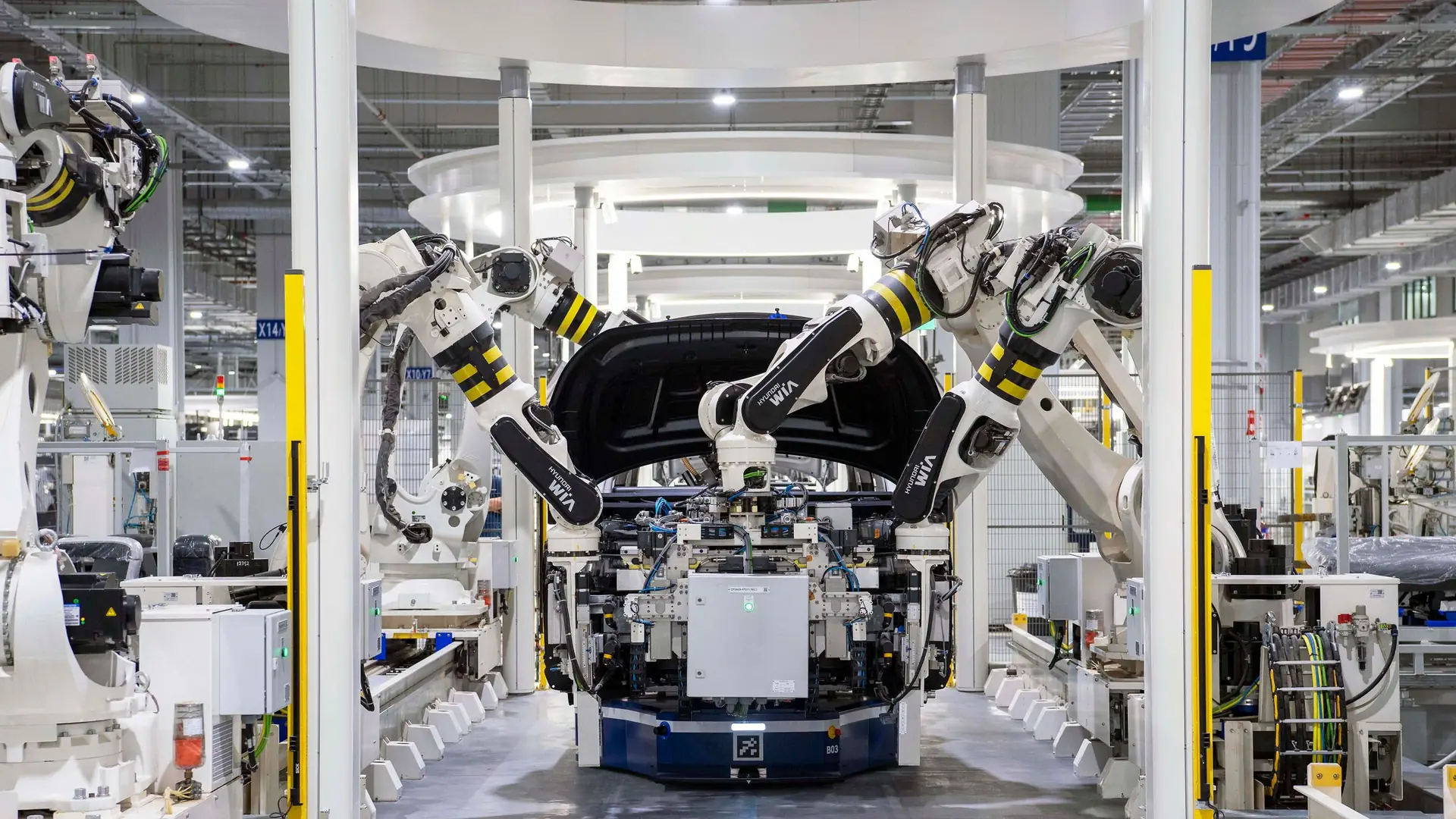 Industrial robots assembling a car body on an automotive production line