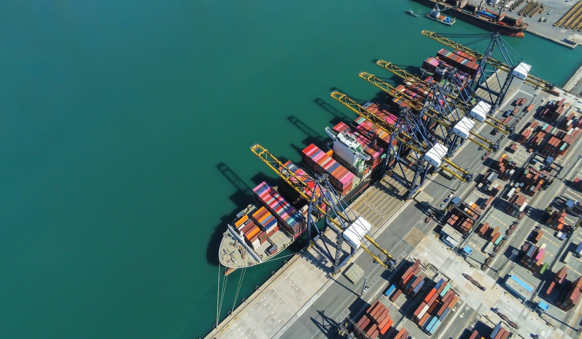 Aerial view of a container ship being loaded by gantry cranes at the Port of Virginia