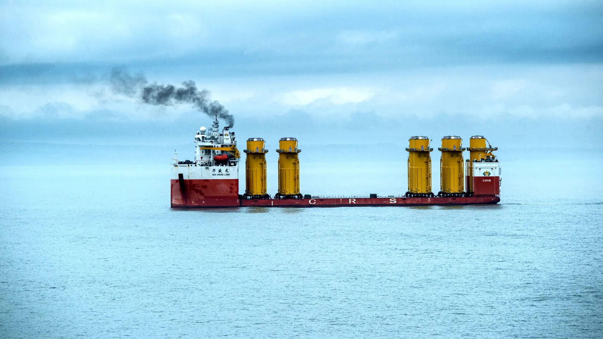 A heavy-lift cargo ship transporting oversized industrial equipment at sea